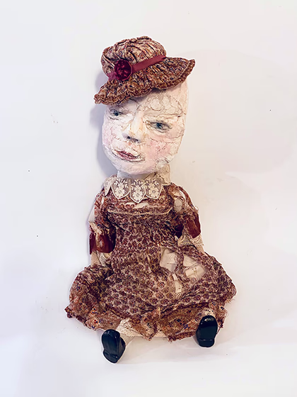 Hacked doll with decayed silk dress